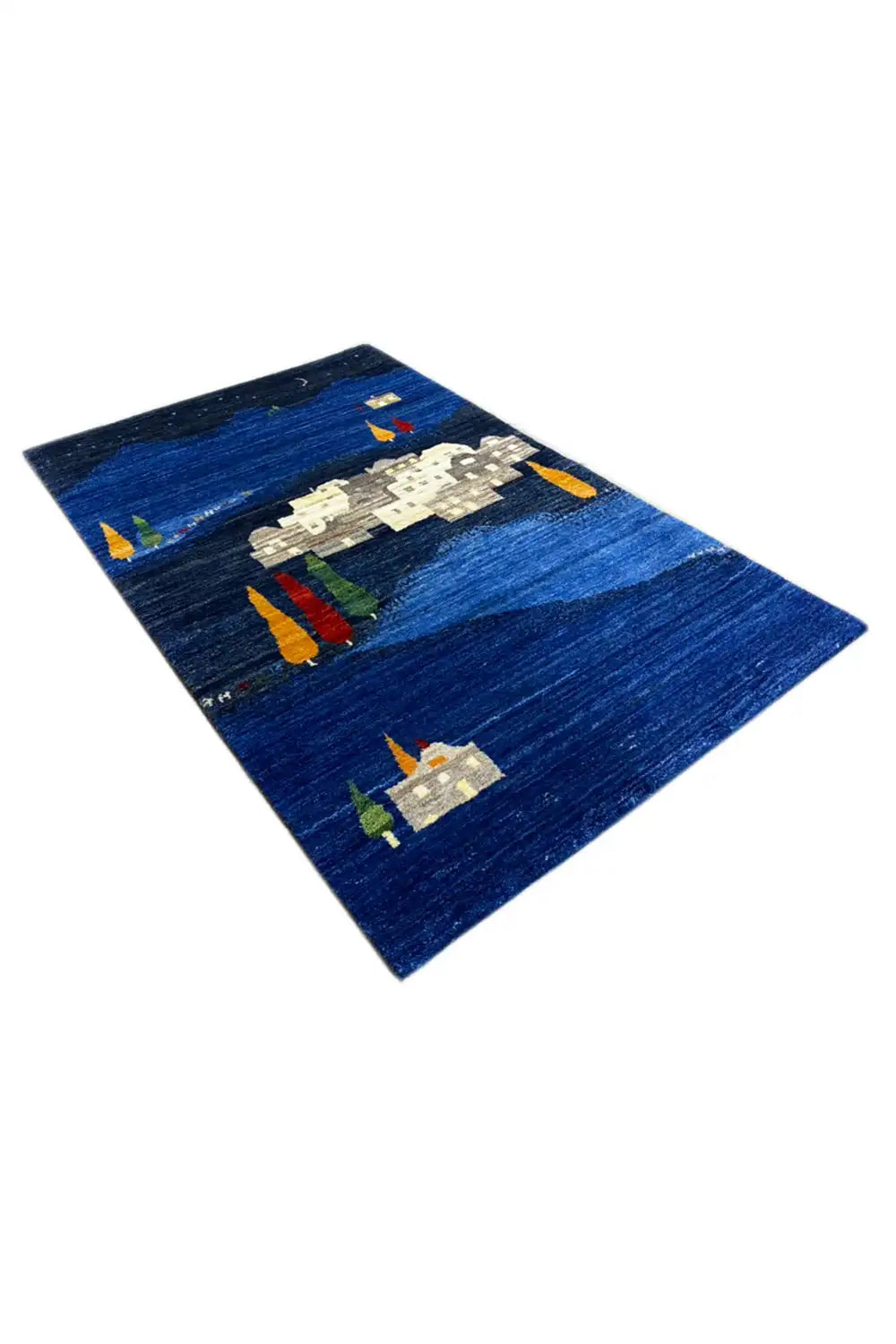 Blue Gabbeh rug with white buildings, orange-yellow candles, and green trees