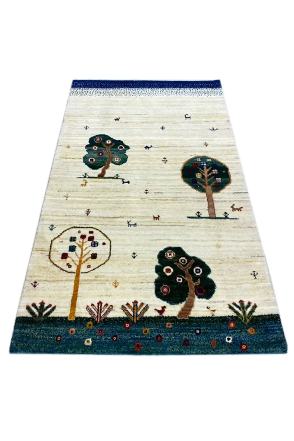 Rug laid flat: light beige base with tree and animal motifs, edged in blue