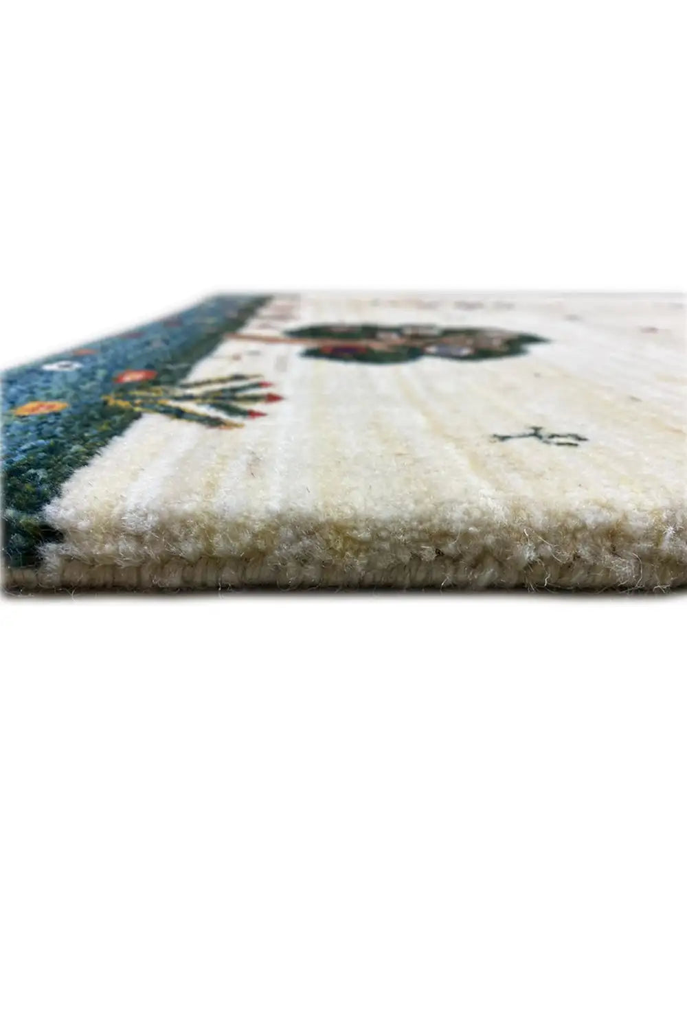 Carpet detail with pile and knotted border, light beige surface with dark blue edging