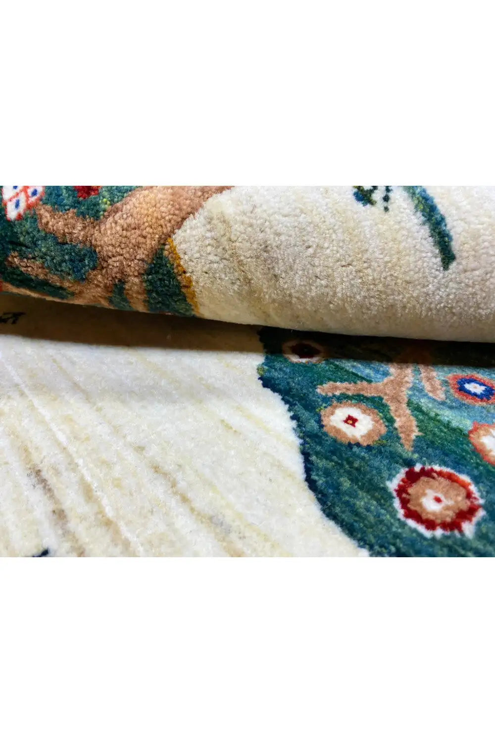 Carpet detail at the edge: dense pile, pattern with colorful circles and a blue background