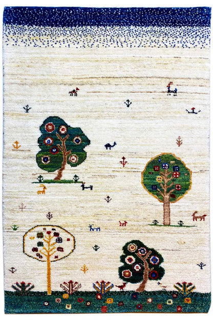 Gabbeh rug with tree and animal motifs on a beige background; dark green base, blue band at the top.
