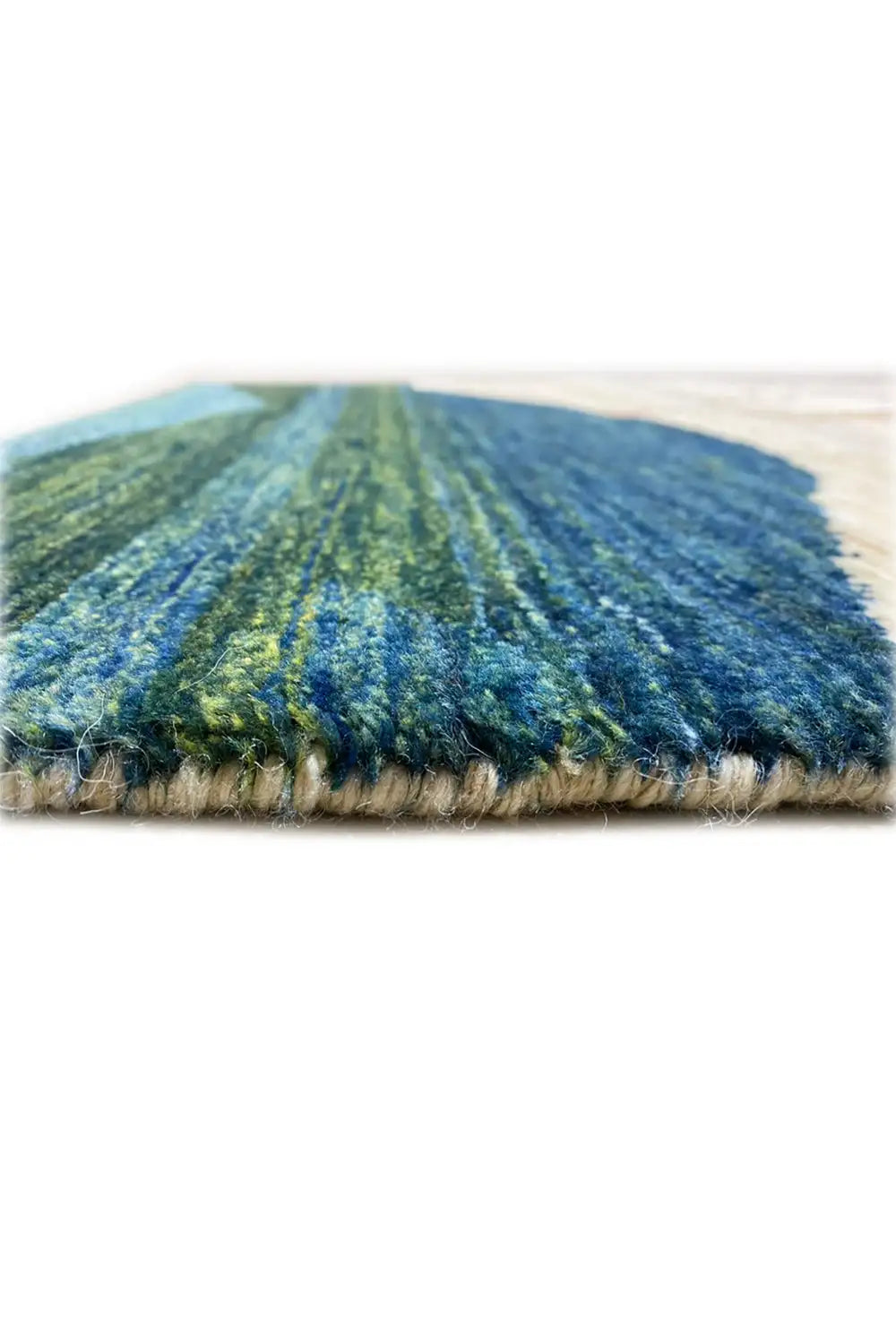 Gabbeh rug 122x78 cm, close-up of the pile surface with blue-green color gradients.