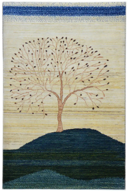 Gabbeh rug 122x78 cm with a tree motif, blue and beige bands of color, handwoven.