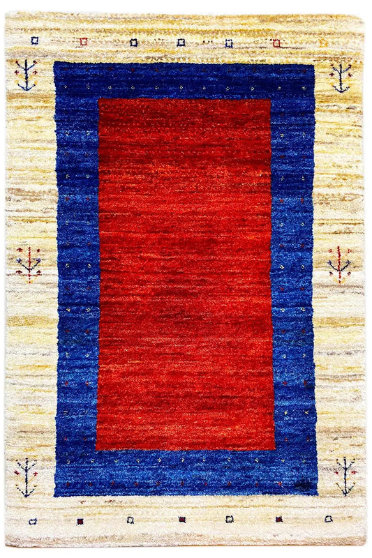 Gabbeh rug: red rectangle in a dark blue frame, cream border with small decorations