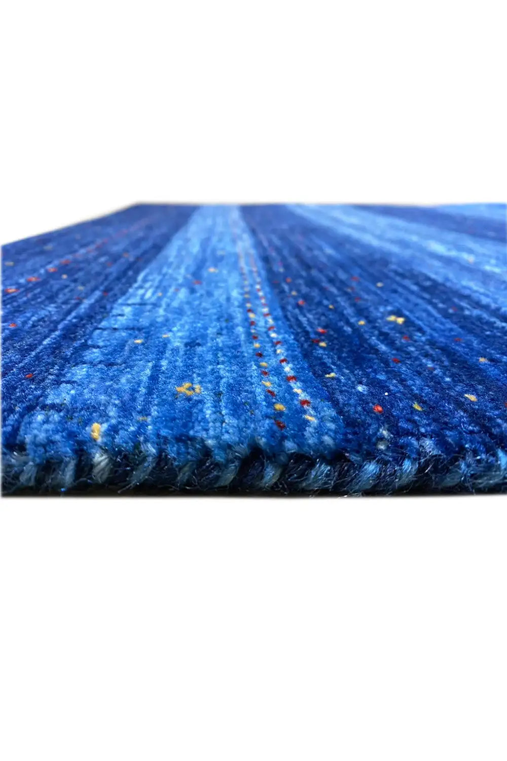 Blue carpet with dense pile along the edges and colorful dots