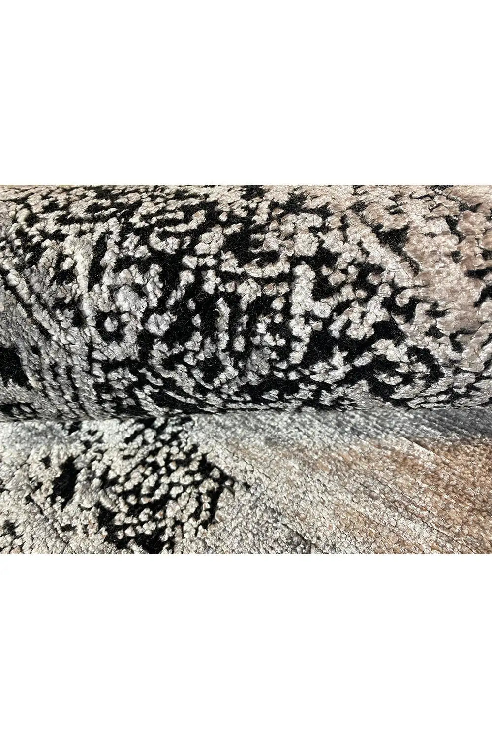 Carpet detail with light and dark dot pattern, dense pile