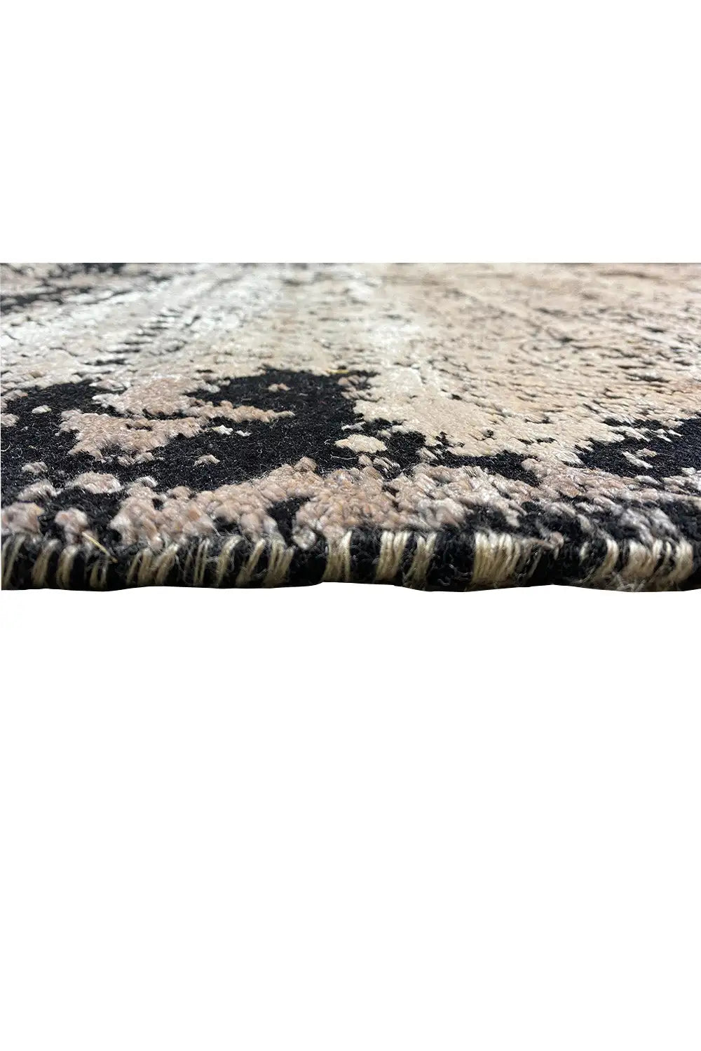 Carpet edge with visible pile height and fringe, black-gray brightness