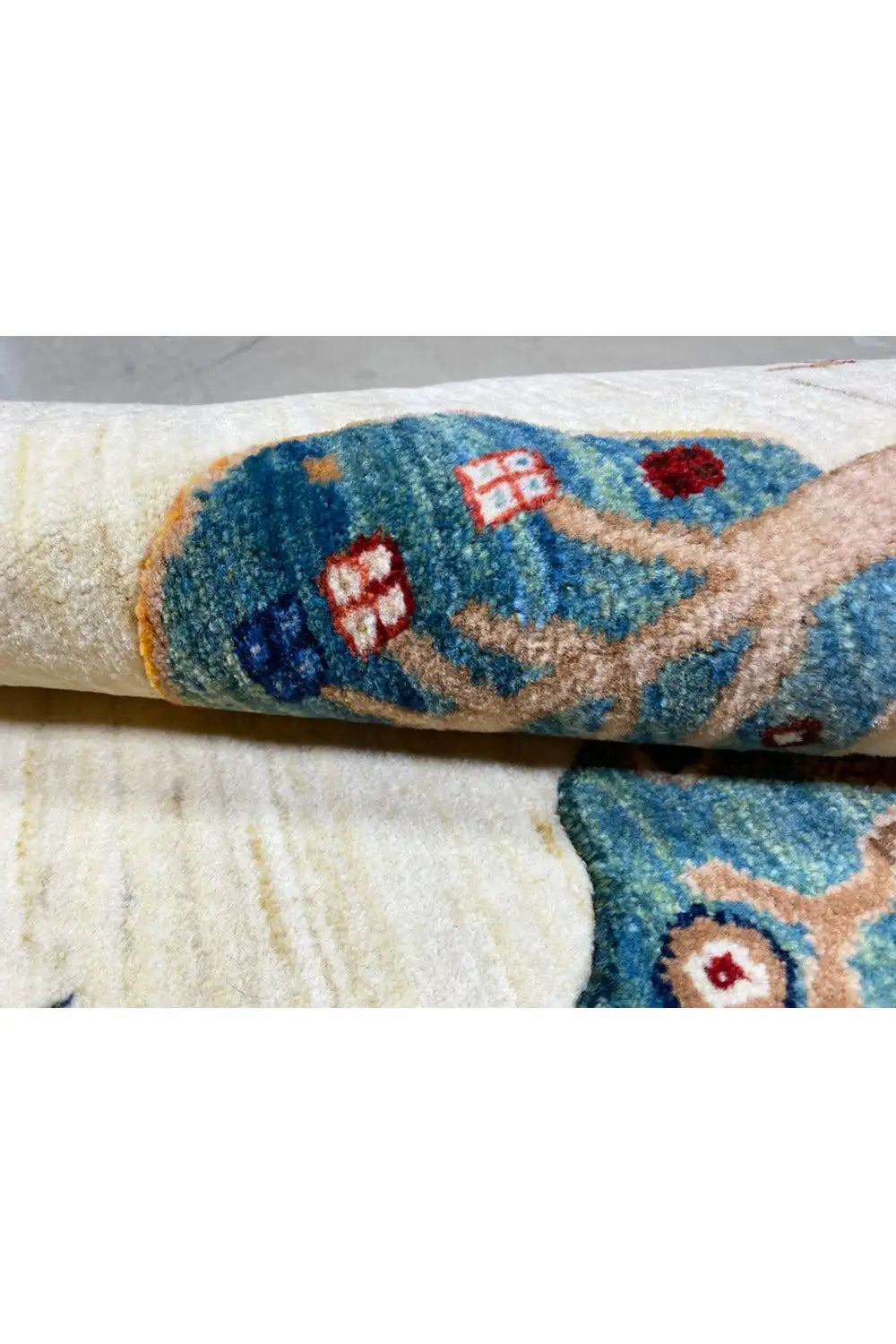Gabbeh rug 122x76 cm Detail: knotted yarn, blue ornament along the edge