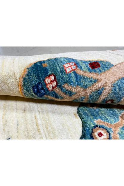 Gabbeh rug 122x76 cm Detail: knotted yarn, blue ornament along the edge
