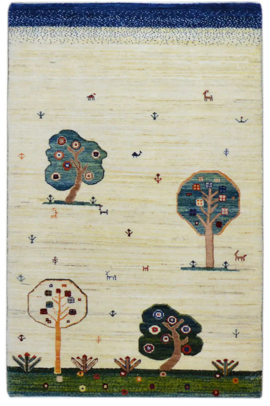 Gabbeh rug 122x76 cm: cream-colored, edged in blue, with tree and animal patterns