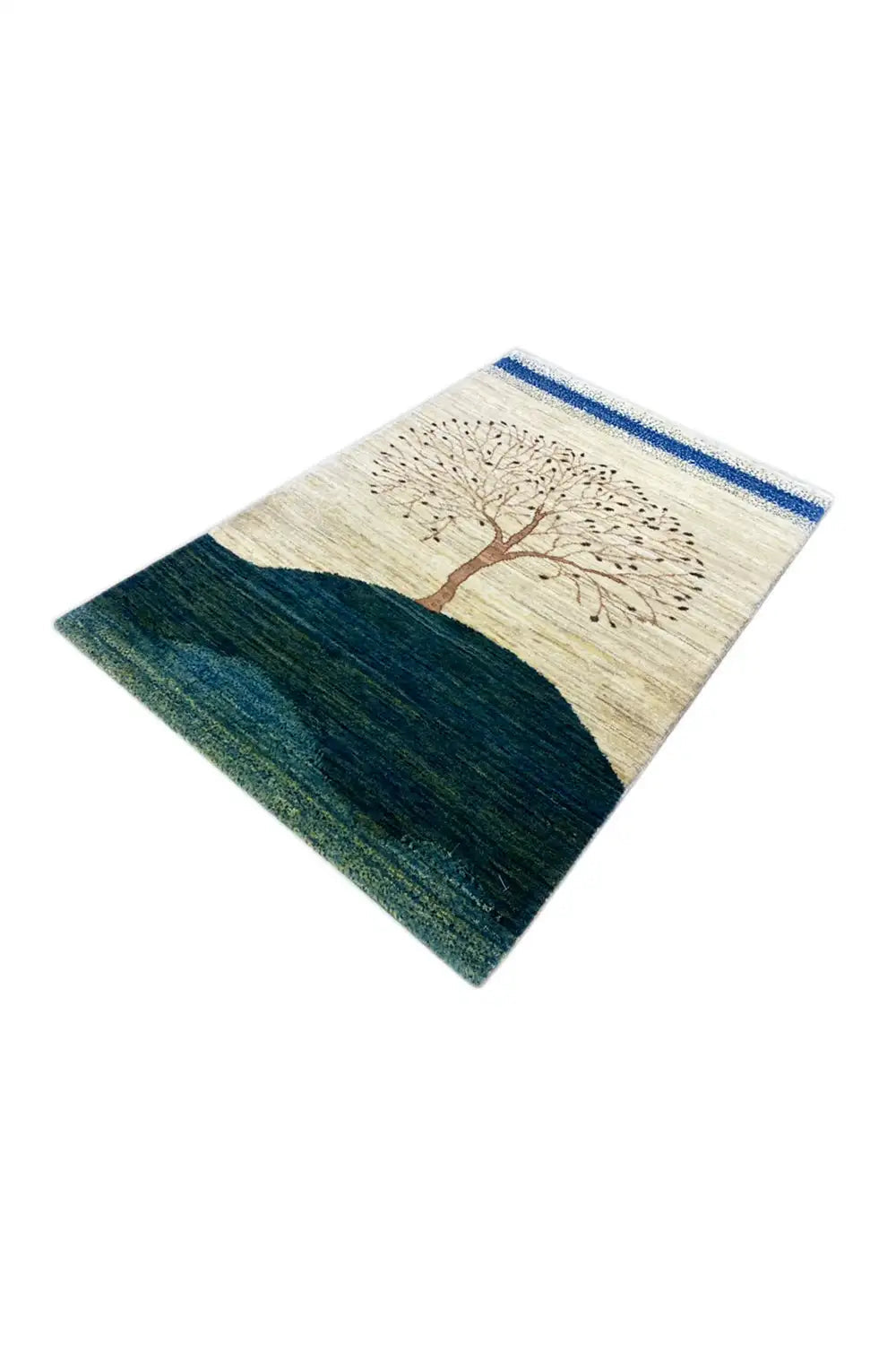 Gabbeh rug laid at an angle, tree motif in the center, dark blue-green hill