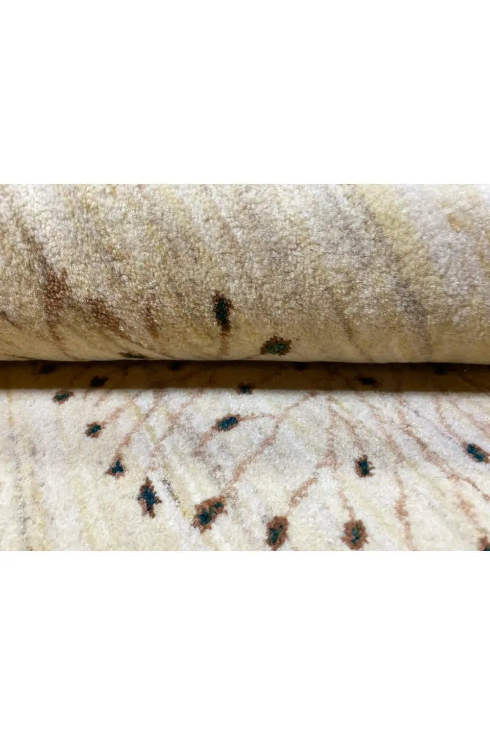 Gabbeh rug pile in close-up, beige background with dark patterned dots