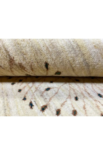 Gabbeh rug pile in close-up, beige background with dark patterned dots
