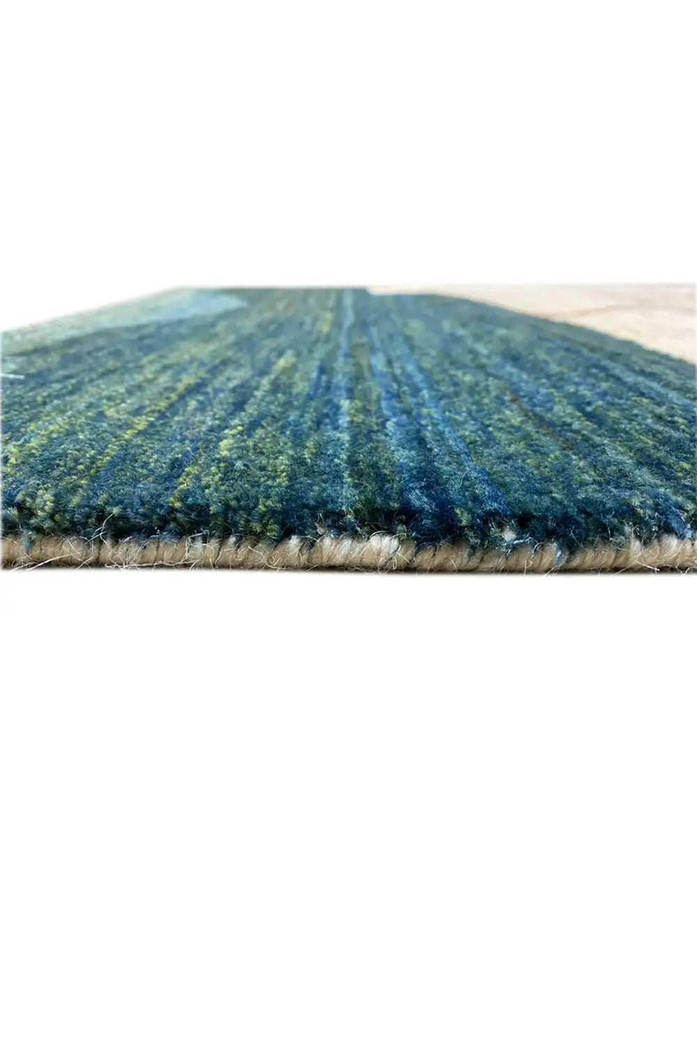 Gabbeh rug from the front, dense pile with blue-green rolling hills and a beige background