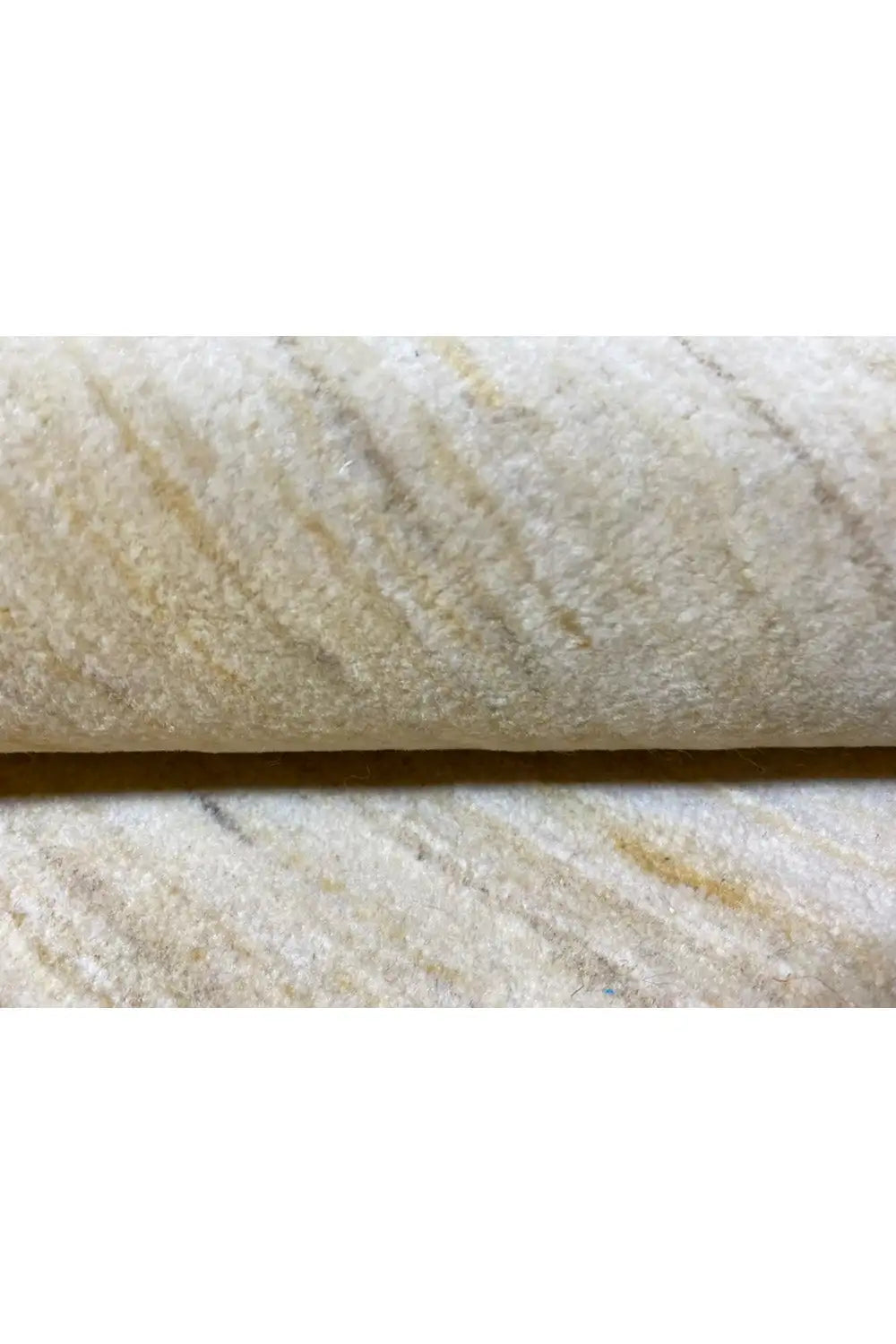 Carpet fabric in detail: light, even pile texture with fine lines