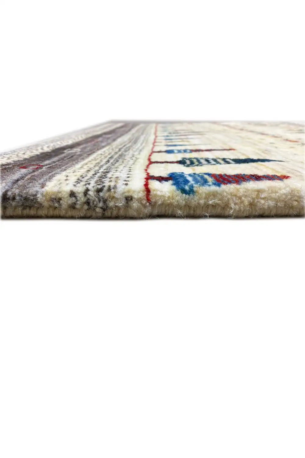 Gabbeh rug, edge detail: cream border and colored decorative stitching along the rug’s edge