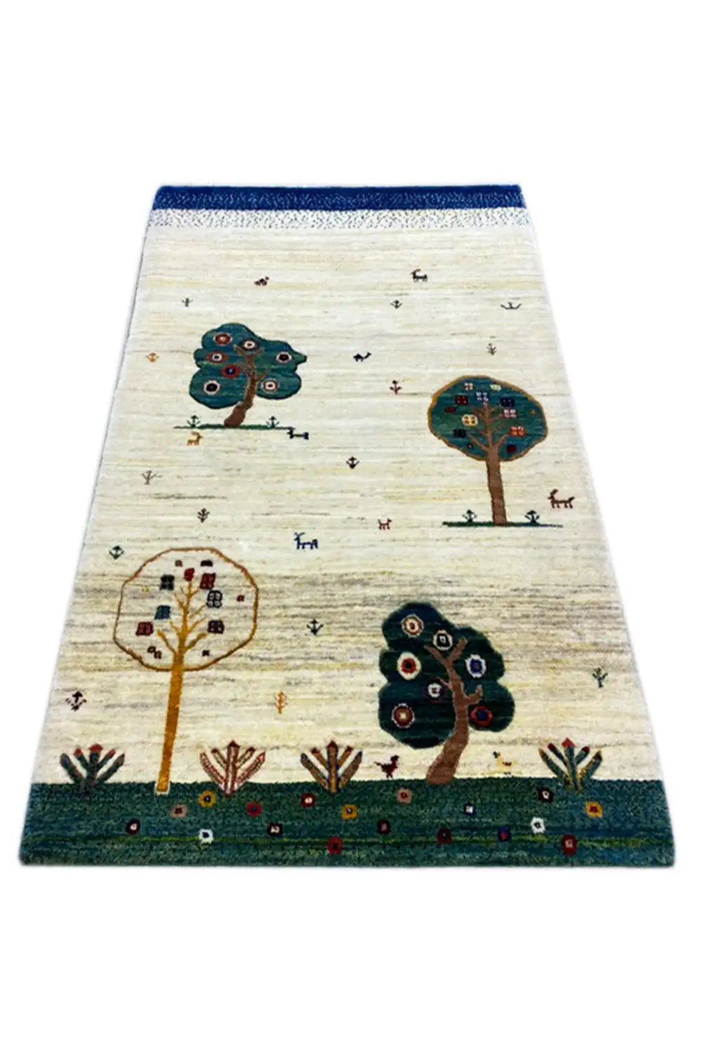 Gabbeh rug 120x76 cm, shown at an angle: cream with tree and animal motifs