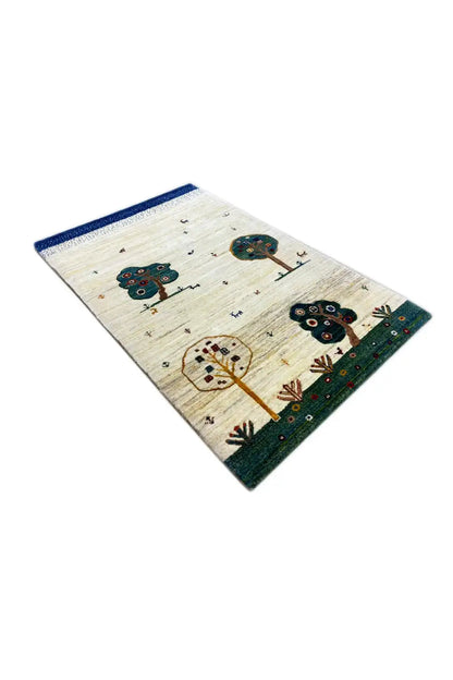 Gabbeh rug 120x76 cm, diagonal view: cream with tree and house motif