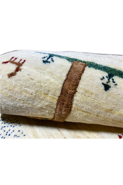 Gabbeh rug 120x76 cm Detail: cream-colored pile texture with a blue-green border
