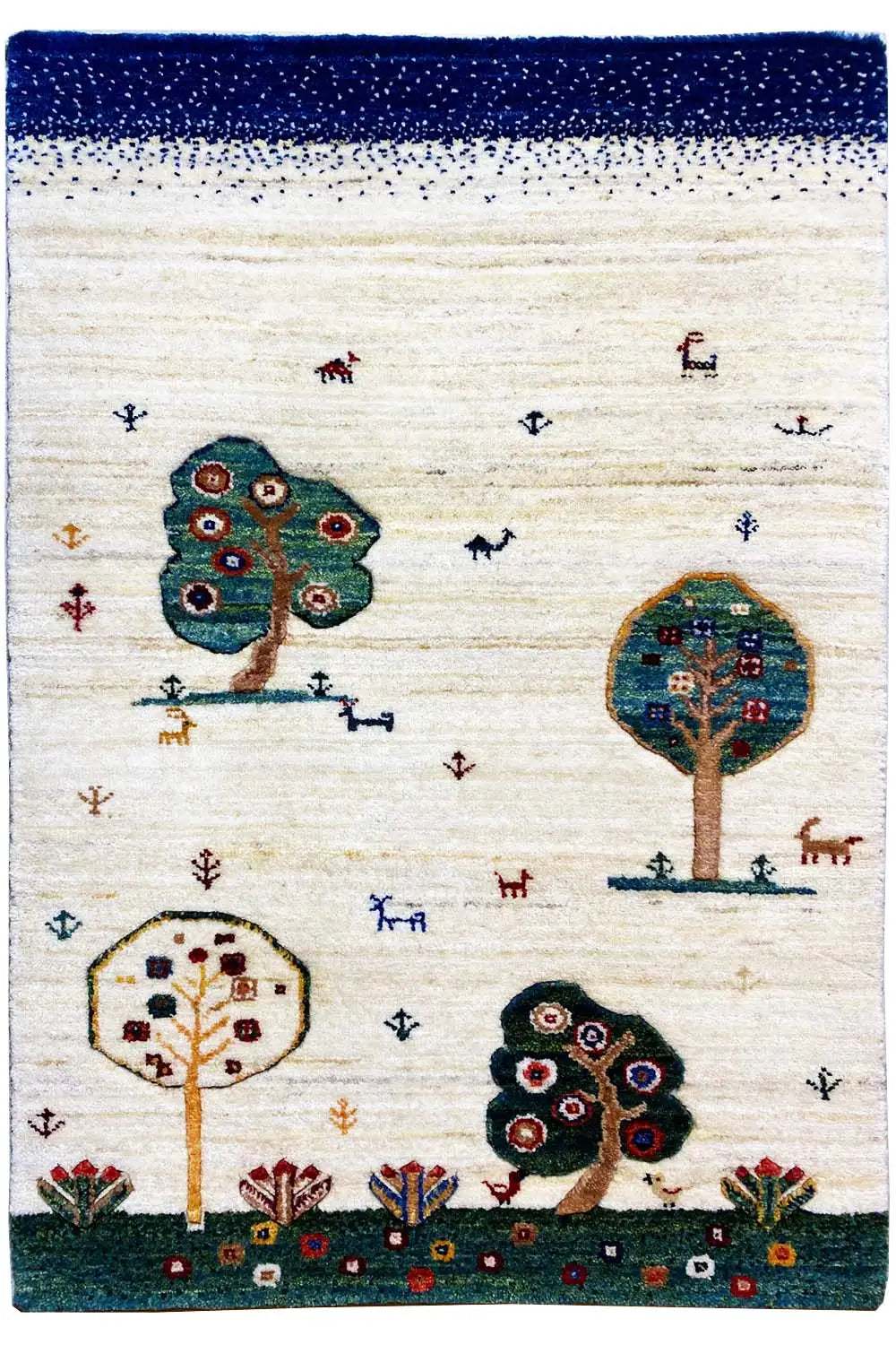 Gabbeh rug, cream with a blue border, trees and animals in a colorful ornamental pattern