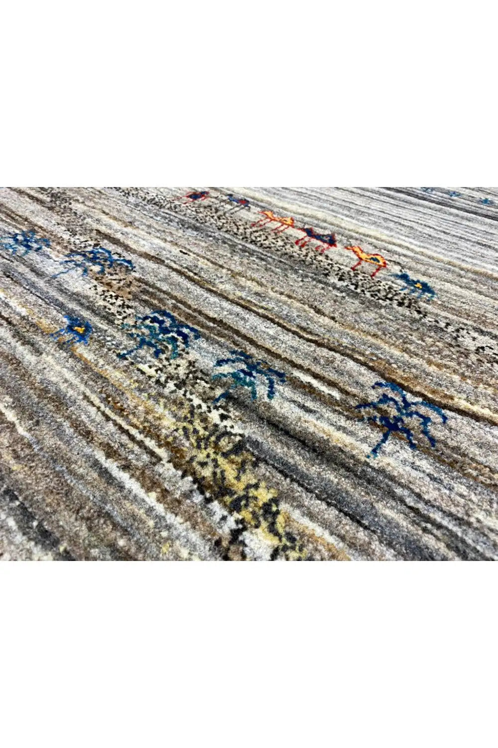 Gabbeh rug 123x77 cm, close-up of the texture: gray stripes with blue figures
