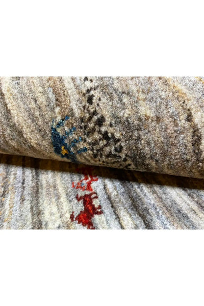 Gabbeh rug 123x77 cm, close-up: gray pile with a red and blue pattern