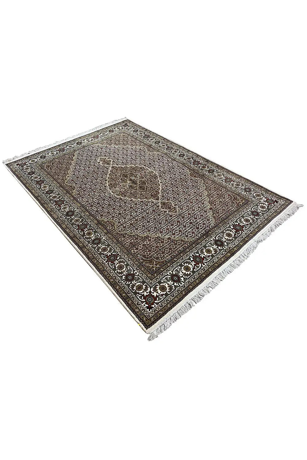 Rug in brown and gray tones with an ornamental border and surrounding fringe trim