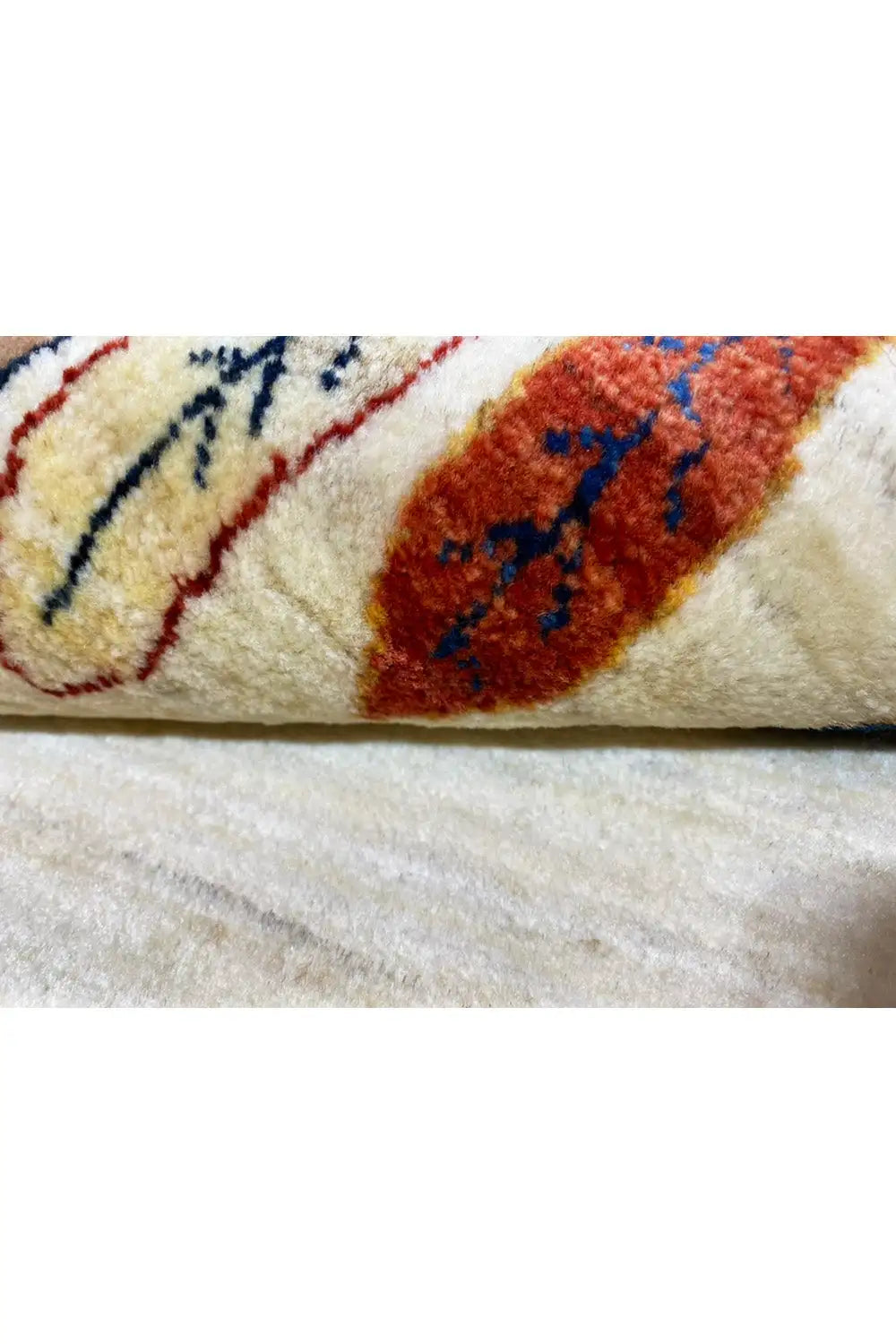 Gabbeh rug 161x87 cm Detail: pile and woven ornaments in red, blue, and brown