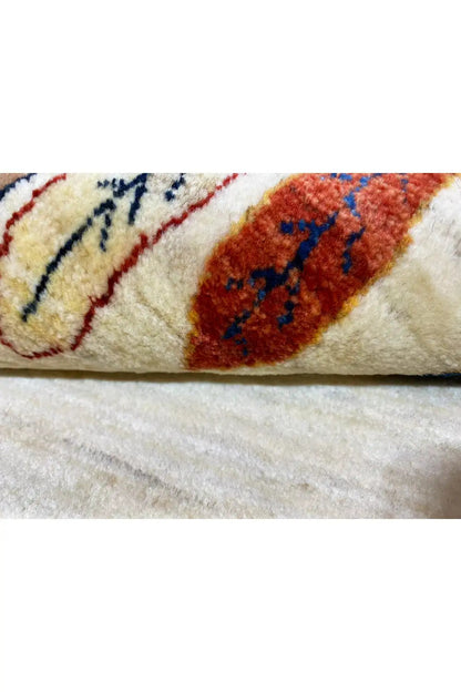 Gabbeh rug 161x87 cm Detail: pile and woven ornaments in red, blue, and brown