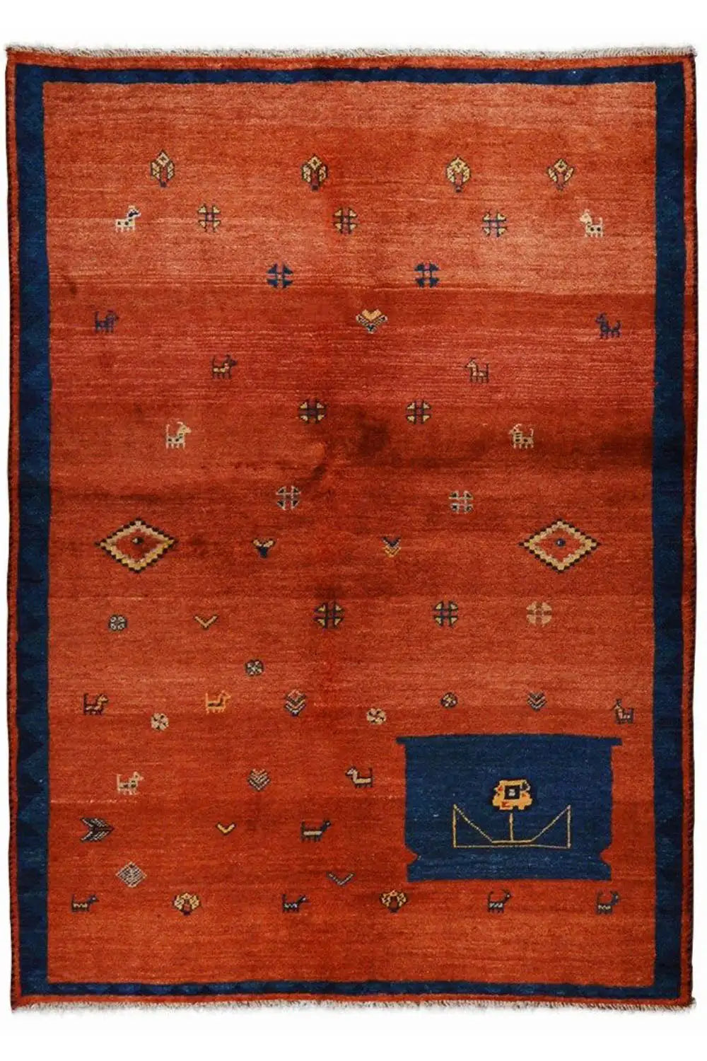 Red carpet with a blue border, many small symbols, and a dark blue corner panel, fringe