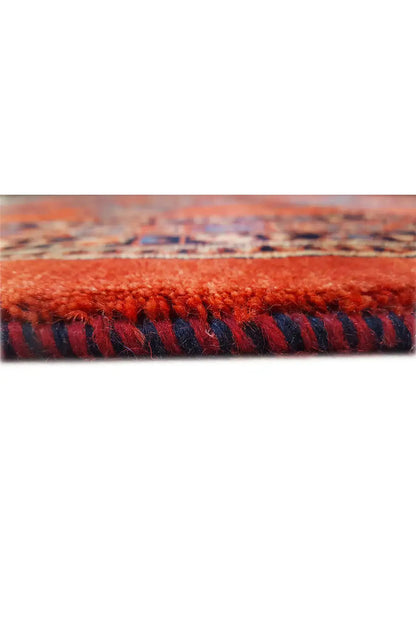 Close-up of carpet edge with multicolored border and short pile