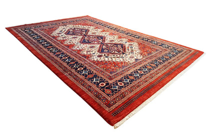 Rectangular oriental rug with a red border, blue patterned frieze, and centered medallion