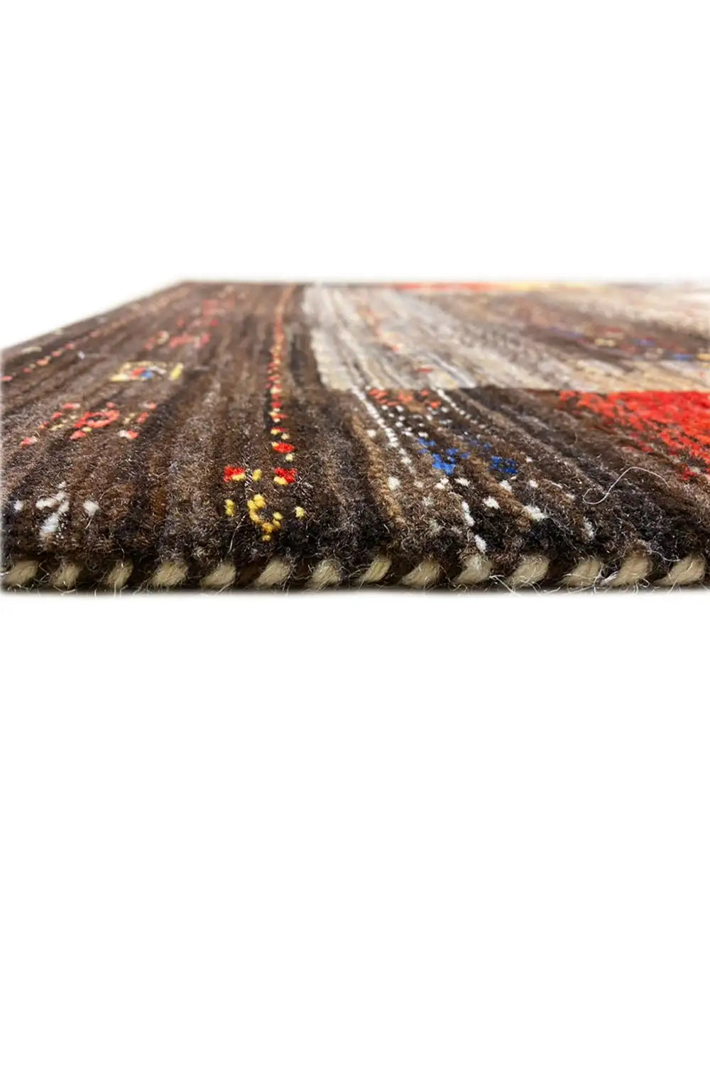 Gabbeh rug edge view: pile with multicolored dots on a dark background