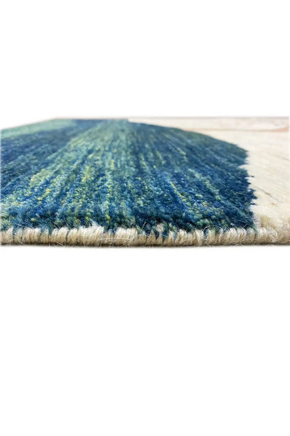 Gabbeh rug (157x86 cm) close-up: pile and edge finish with dark blue patterned area