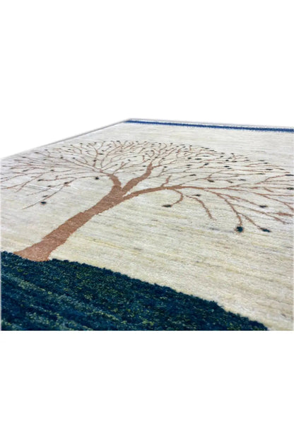Gabbeh rug (157x86 cm) close-up: tree crown and trunk on off-white with a dark border