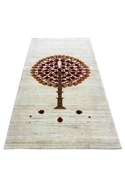 Gabbeh rug 155x89 cm, lying flat: tree motif centered in red/brown on a light background