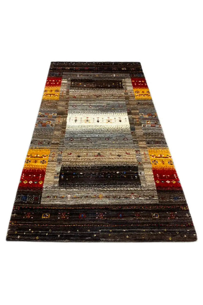Gabbeh rug (136x68 cm) with dark stripes and yellow-red accents, borders