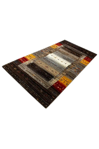 Gabbeh rug (136x68 cm), angled: brown-gray-beige with yellow accents