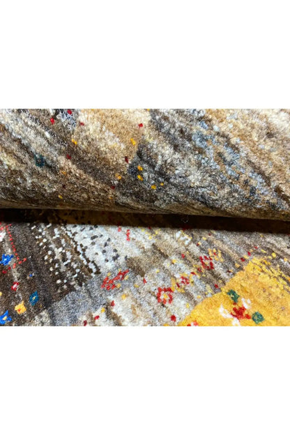 Gabbeh rug (136x68 cm) detail close-up, woven texture with beige and blue accents