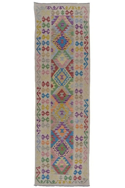 Kilim Afghan rug as a narrow runner with a colorful geometric diamond design