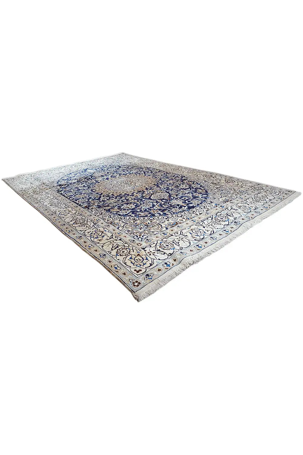 Triangle/diagonal view: beige Oriental rug with a blue central medallion.