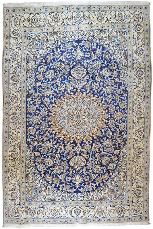 Blue-and-white Oriental rug with an ornamental medallion pattern and border trim.