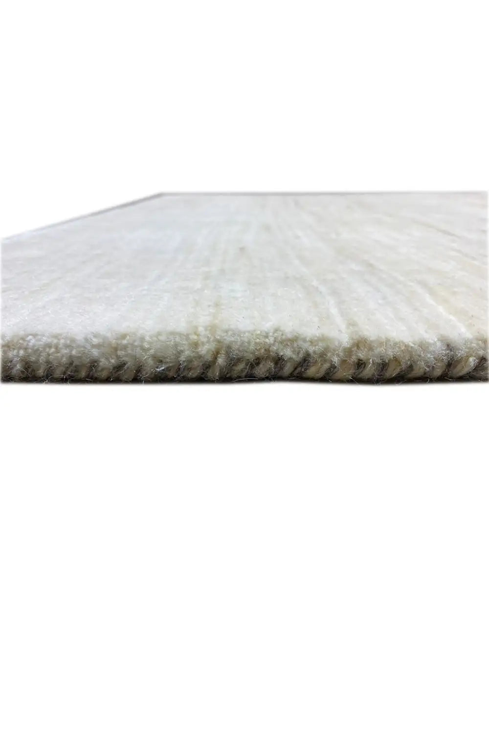 Gabbeh rug close-up: short-pile side with padded edge, light beige surface
