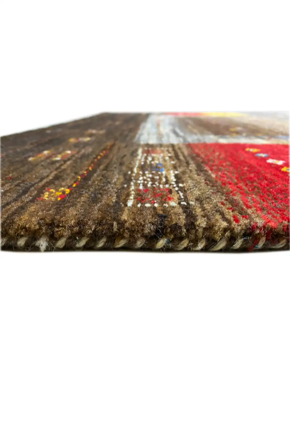 Carpet (160x99 cm) close-up of the edge: frayed pile with red accents