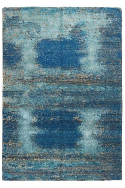 Rectangular designer rug with abstract shapes in light blue and dark blue