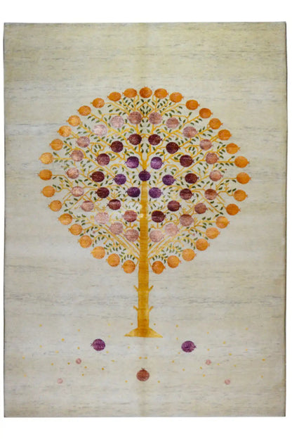 Rectangular Gabbeh rug with a Tree of Life in gold, purple and orange on a light background