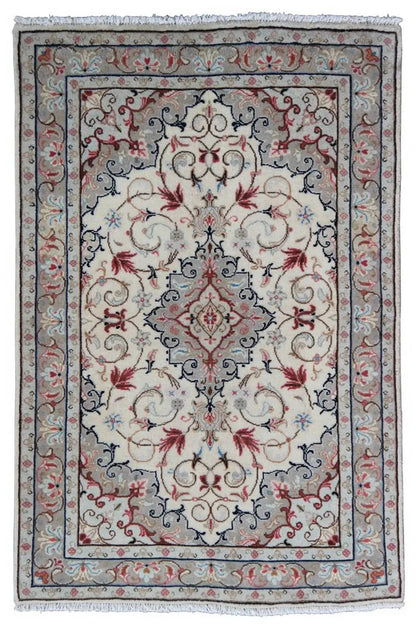 Rectangular Oriental rug with a beige center, blue border, red ornaments, and fringes