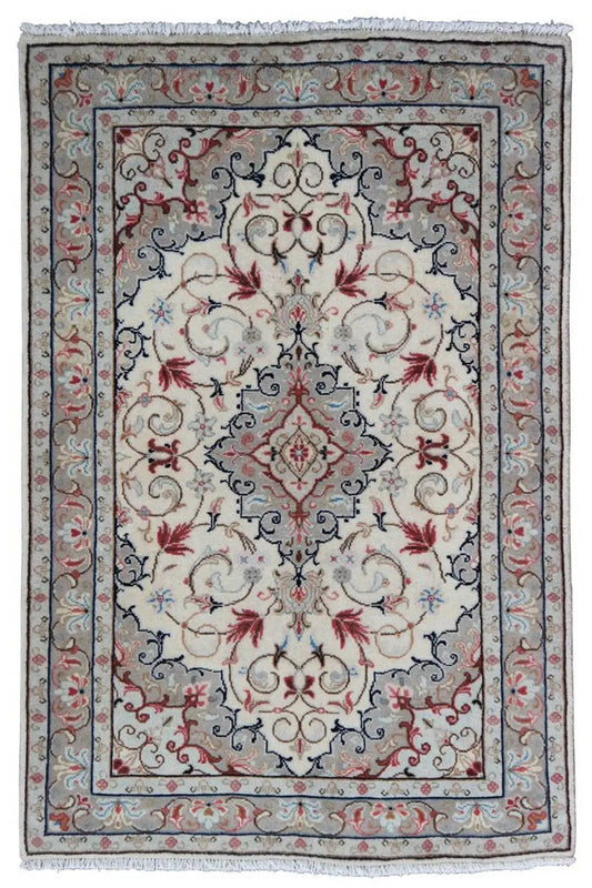 Rectangular Oriental rug with a beige center, blue border, red ornaments, and fringes