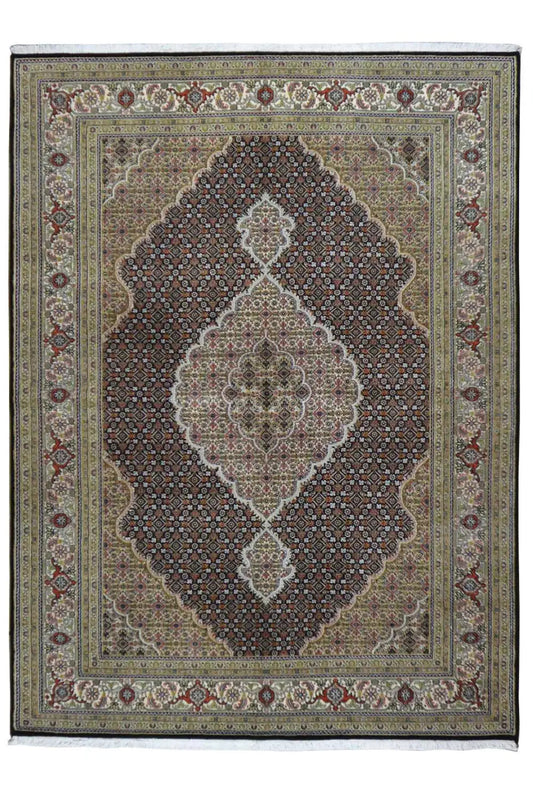 Rug with a central medallion, ornamental pattern, and surrounding border in beige and brown