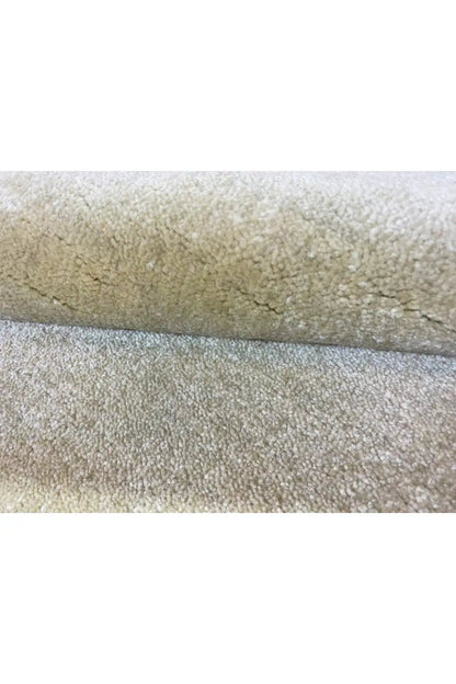 Gabbeh rug, close-up: light beige high pile with a sharply defined edge